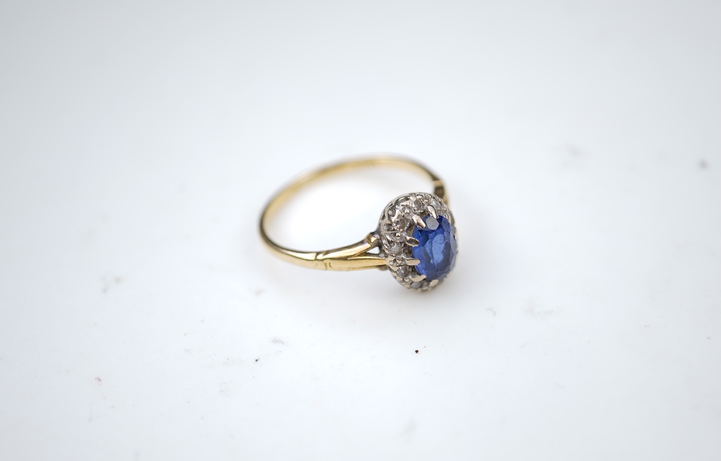 A synthetic sapphire and diamond cluster ring, mid 20th century